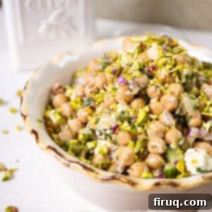 Mediterranean Chickpea Feta Salad 7 Chickpea and feta salad in a bowl topped with pistachios
