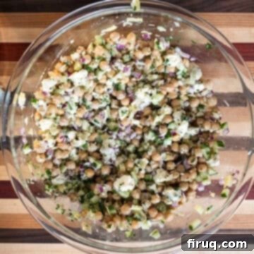 Mediterranean Chickpea Feta Salad 5 Ingredients combined with dressing.