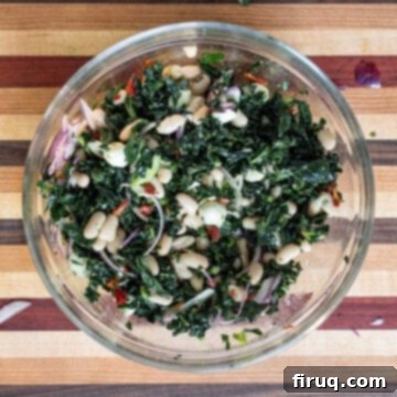 Hearty Kale and White Bean Salad 7 The kale and cannellini bean salad after being tossed with lemon basil vinaigrette, ready to be chilled.