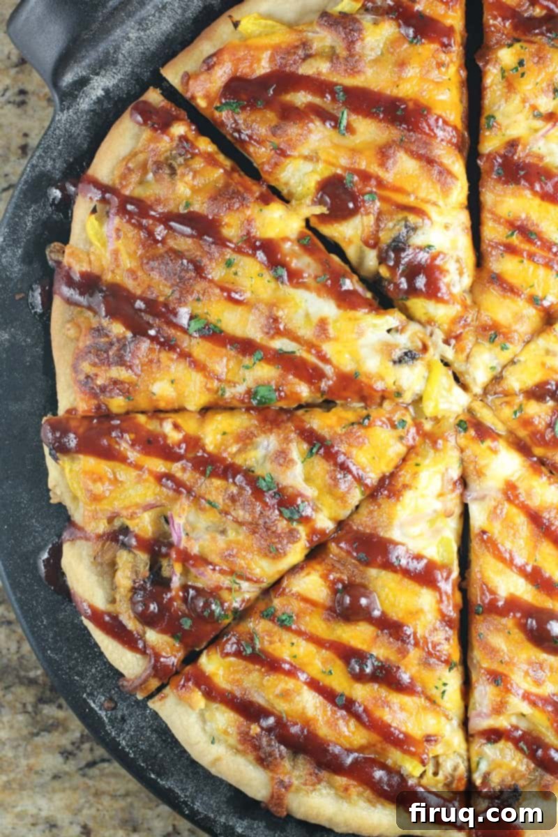 Texas BBQ Pizza 11 top down view of half a sliced pizza
