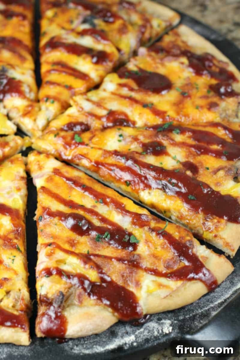 Texas BBQ Pizza 13 angled view of sliced Texas pizza drizzled with bbq sauce