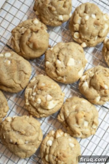 Irresistible Chewy White Chocolate Macadamia Nut Cookies 10 Cookies baked, cooling on a wire rack.