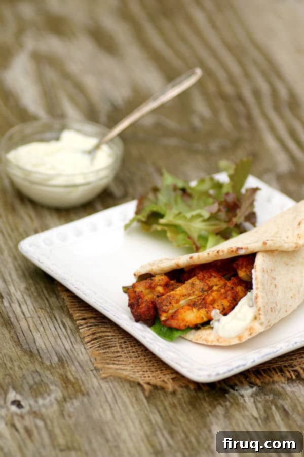 Up-close view of perfectly roasted chicken shawarma Chicken Shawarma Pita