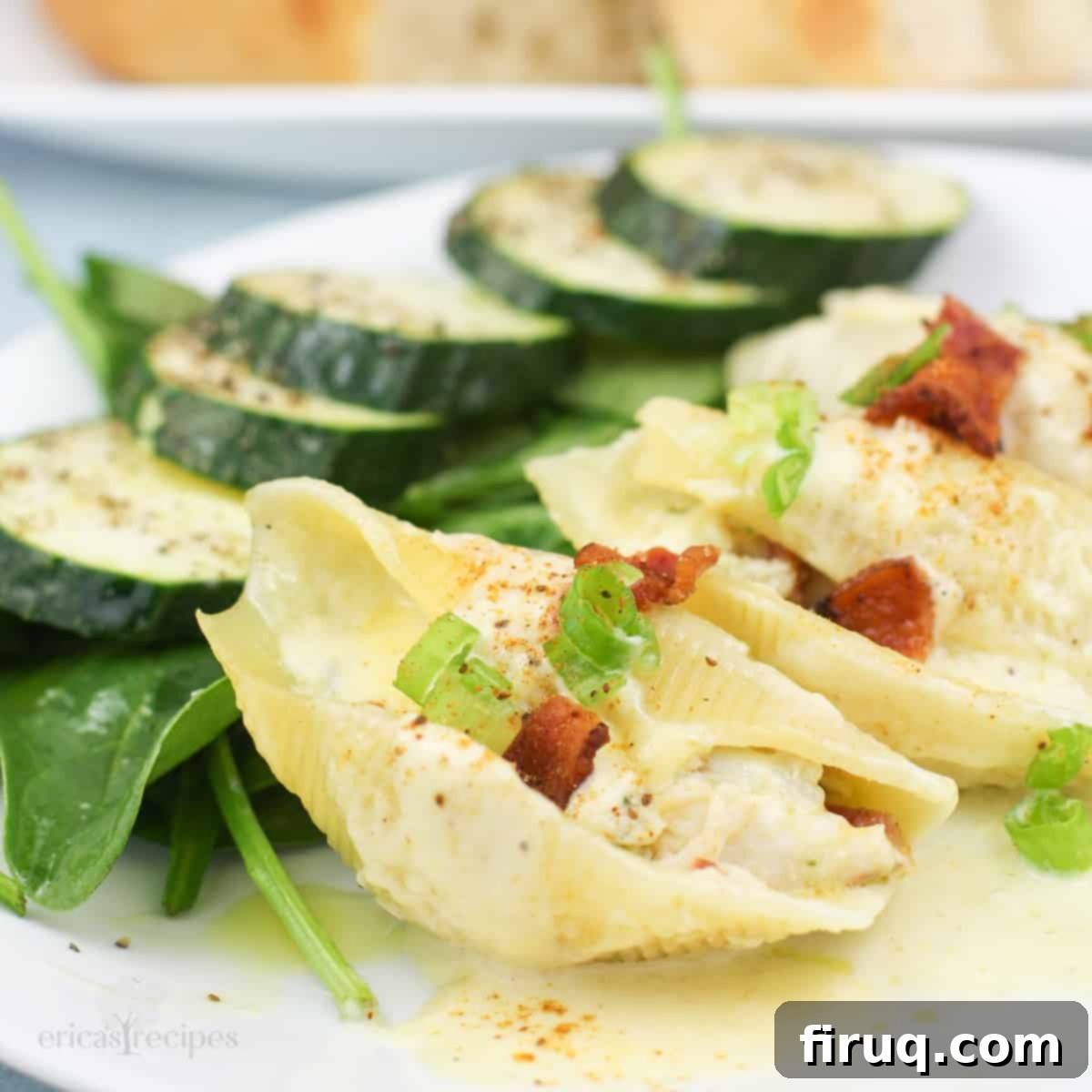 Savory Crab Stuffed Shells 2 three crab stuffed shells on white plate with salad