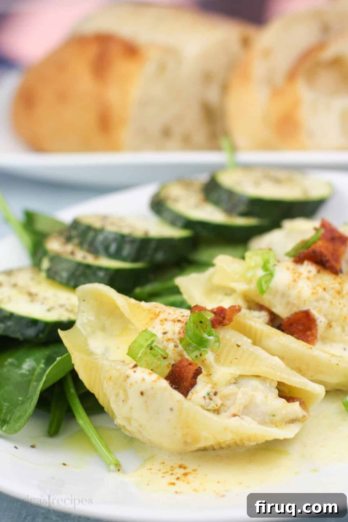 Savory Crab Stuffed Shells 3 plated portion of shells stuffed with crab with salad