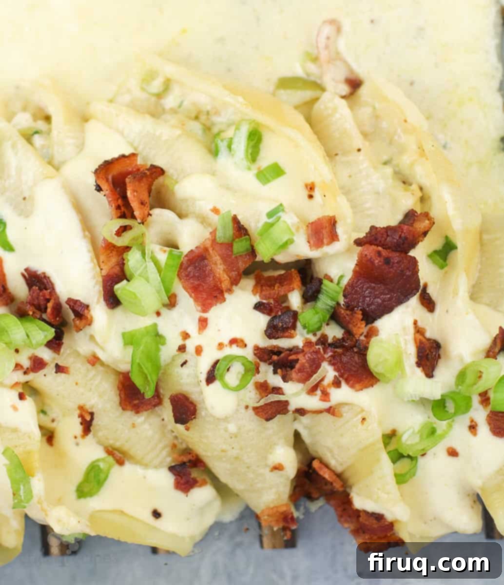Savory Crab Stuffed Shells 7 prepared recipe in bake dish, fresh from the oven topped with green onion and bacon