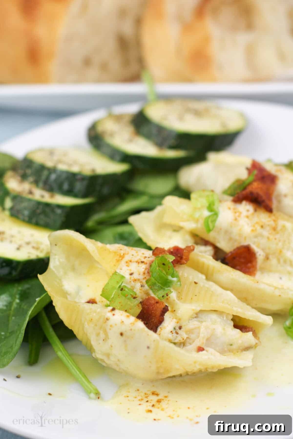 Savory Crab Stuffed Shells 8 stuffed shells with crab meat on white plate with salad