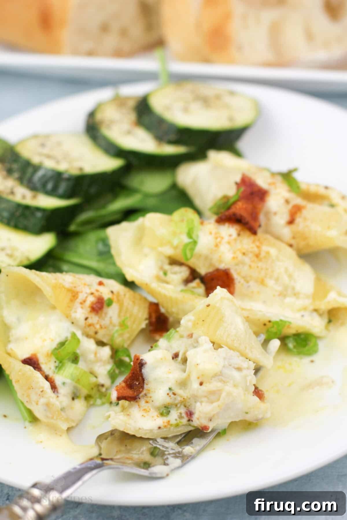 Savory Crab Stuffed Shells 9 fork holding bite of prepared stuffed shells