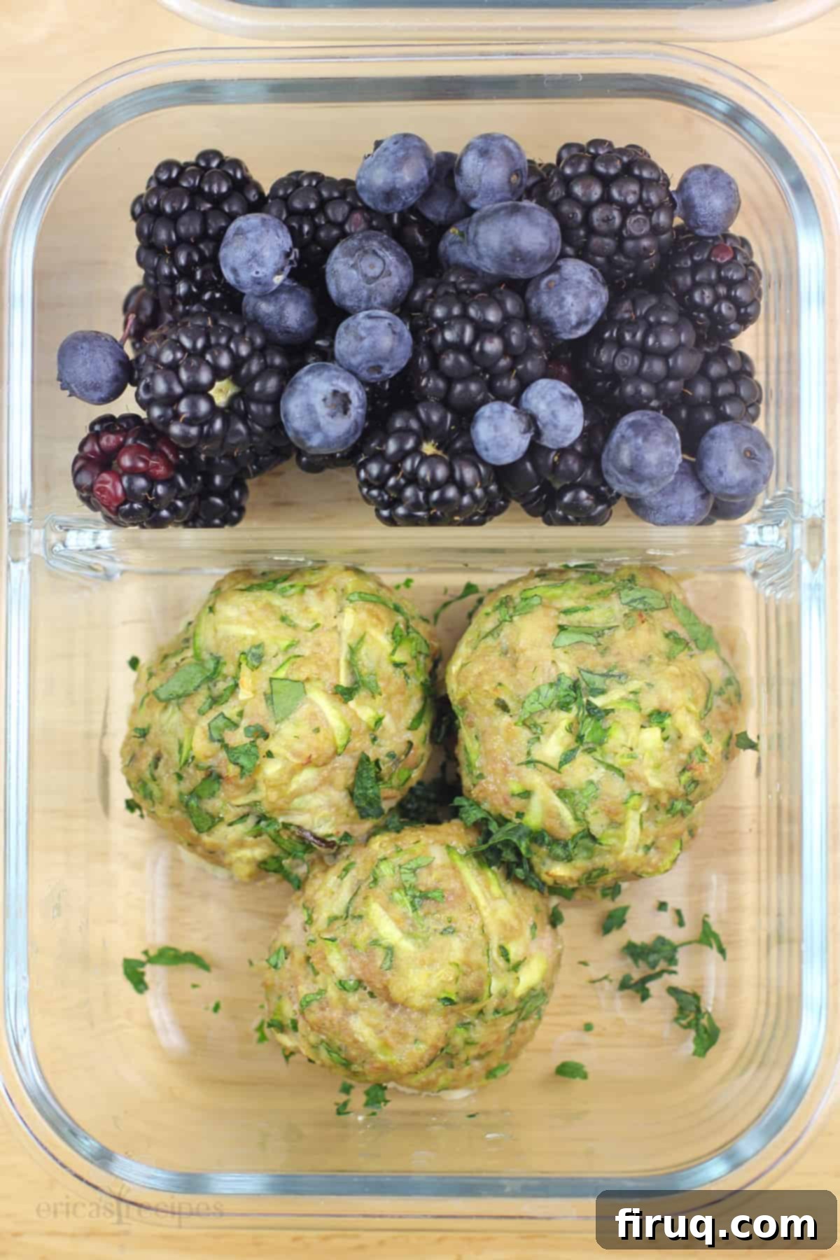 Wholesome Turkey Zucchini Meatballs 3 glass meal-prep container with cooked meatballs and fresh berries
