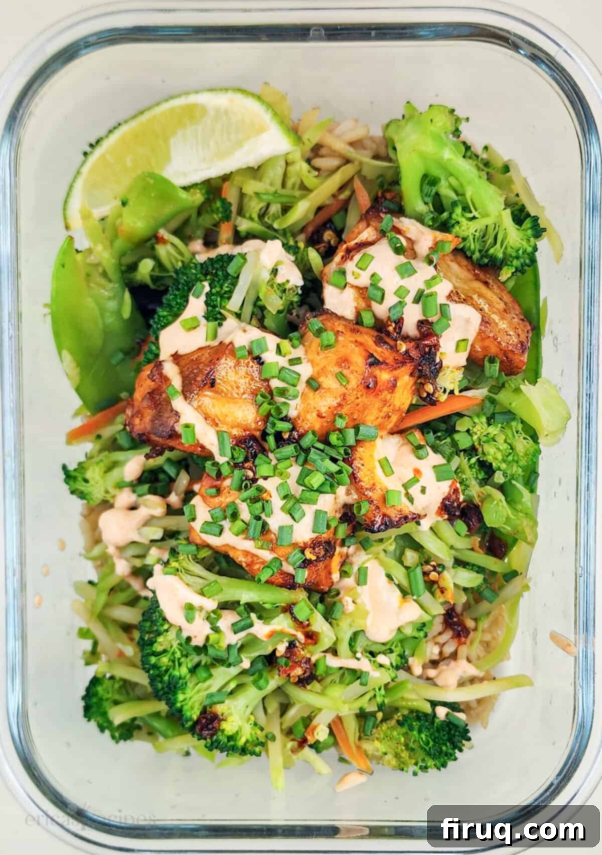 Easy Firecracker Salmon Meal Prep Bowls 4 Three glass meal prep containers filled with firecracker salmon, brown rice, and teriyaki vegetables.