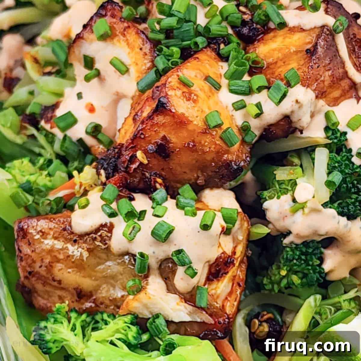 Easy Firecracker Salmon Meal Prep Bowls 6 prepared firecracker salmon and vegetables, topped with chives