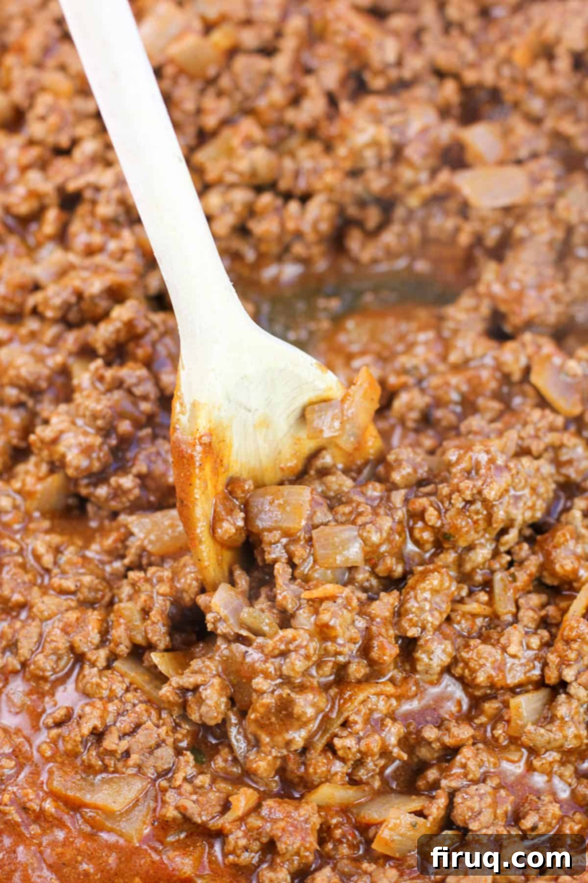 Game-Changing Ground Beef Tacos 6 prepared taco meat in skillet with wooden spoon