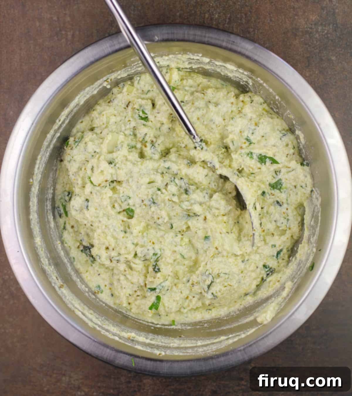 Rich Pesto Salmon Lasagna 5 prepared pesto ricotta in metal bowl with spoon