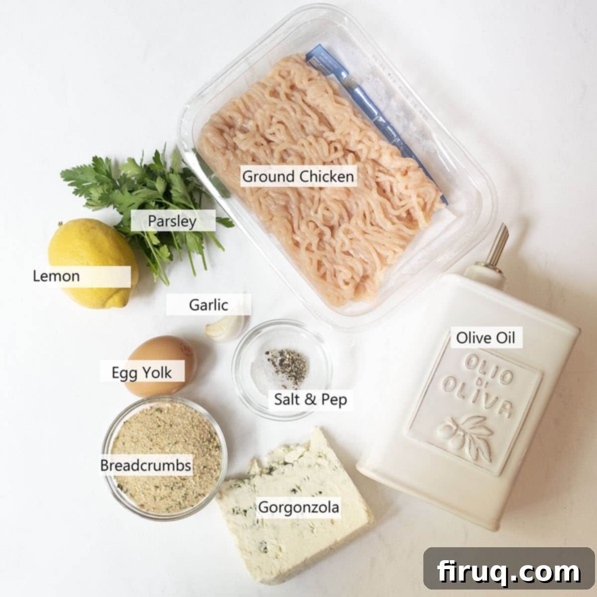 Gourmet Gorgonzola Grilled Chicken Burger 3 A selection of fresh ingredients including ground chicken, a block of gorgonzola cheese, fresh parsley, and breadcrumbs, arranged for the recipe.