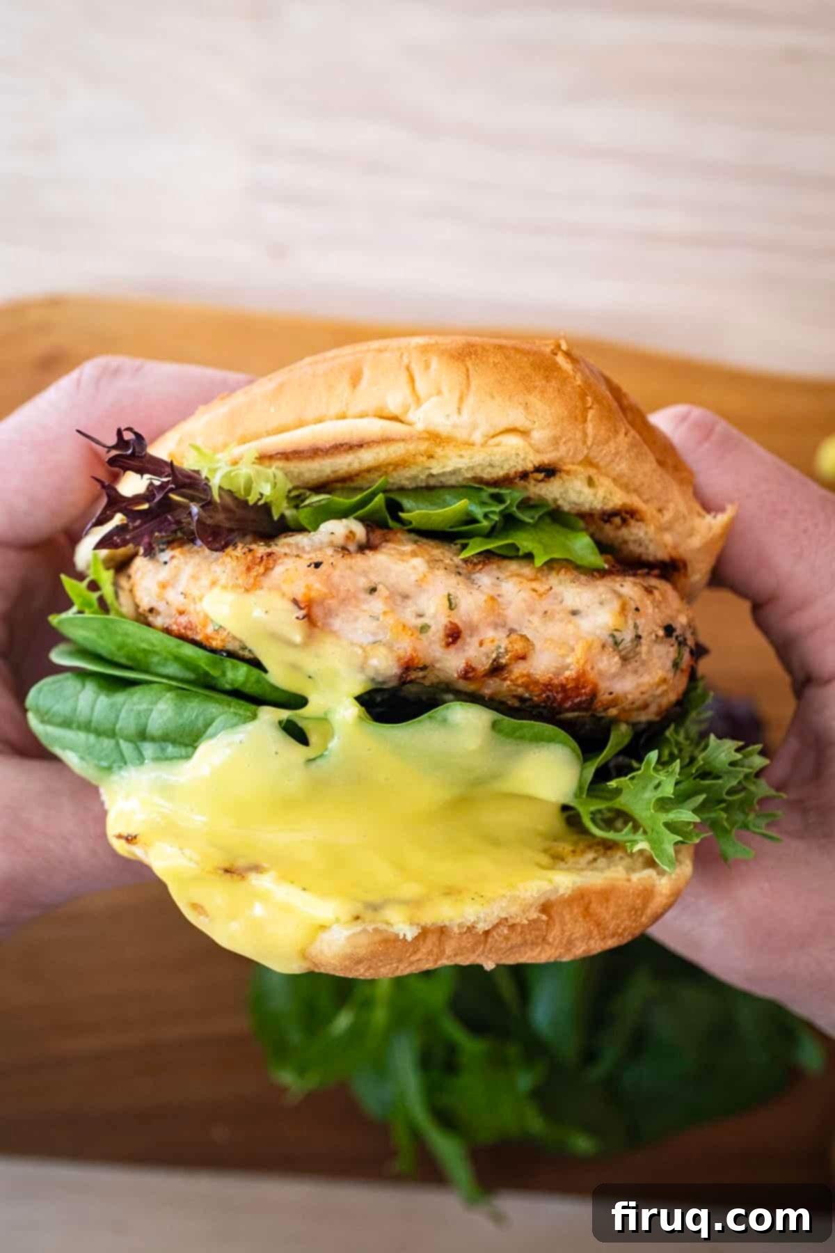 Gourmet Gorgonzola Grilled Chicken Burger 9 A fully assembled grilled chicken burger on a toasted bun, generously topped with garlic aioli and fresh green spring mix.