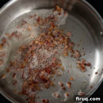 Brussels Sprout Salad with Crispy Pancetta 6 Pancetta frying in a sauce pan.