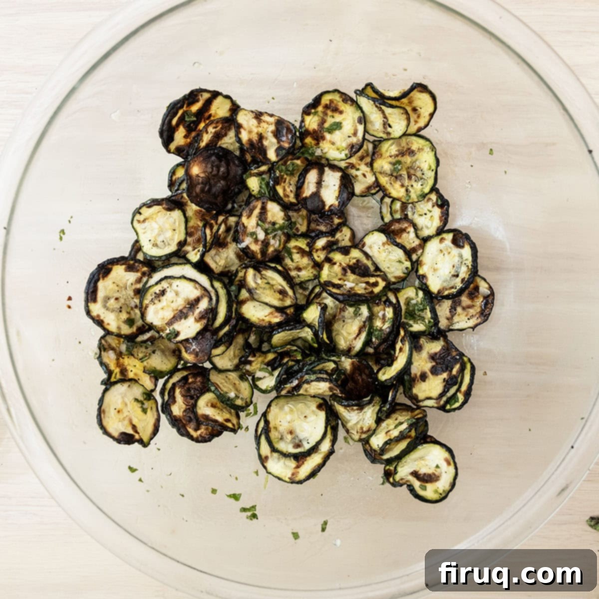 Zesty Marinated Zucchini 8 Grilled zucchini in a large bowl, being tossed with the fresh mint dressing.