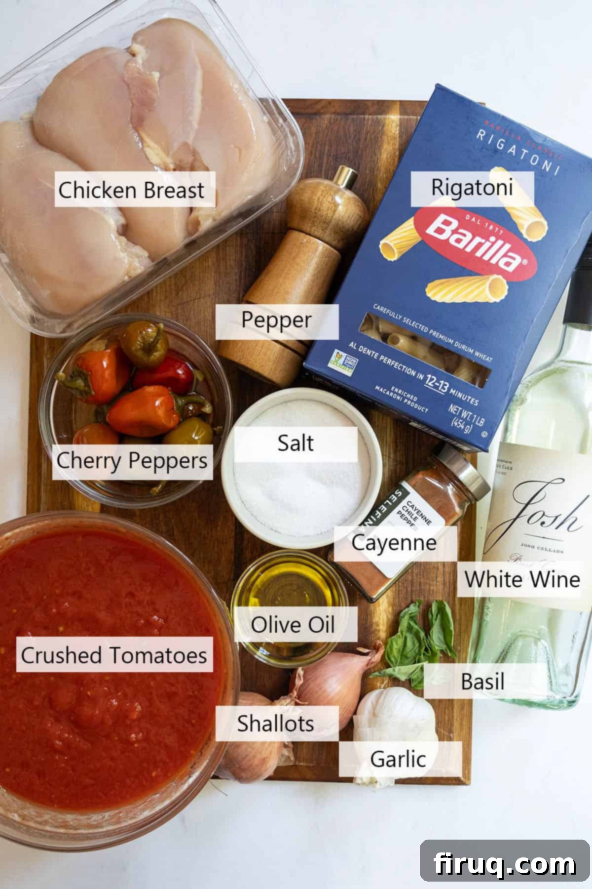 Spicy Chicken Rigatoni 3 A flat lay image displaying all the fresh ingredients required to make the Spicy Chicken Riggies recipe, including chicken, pasta, peppers, and cream.