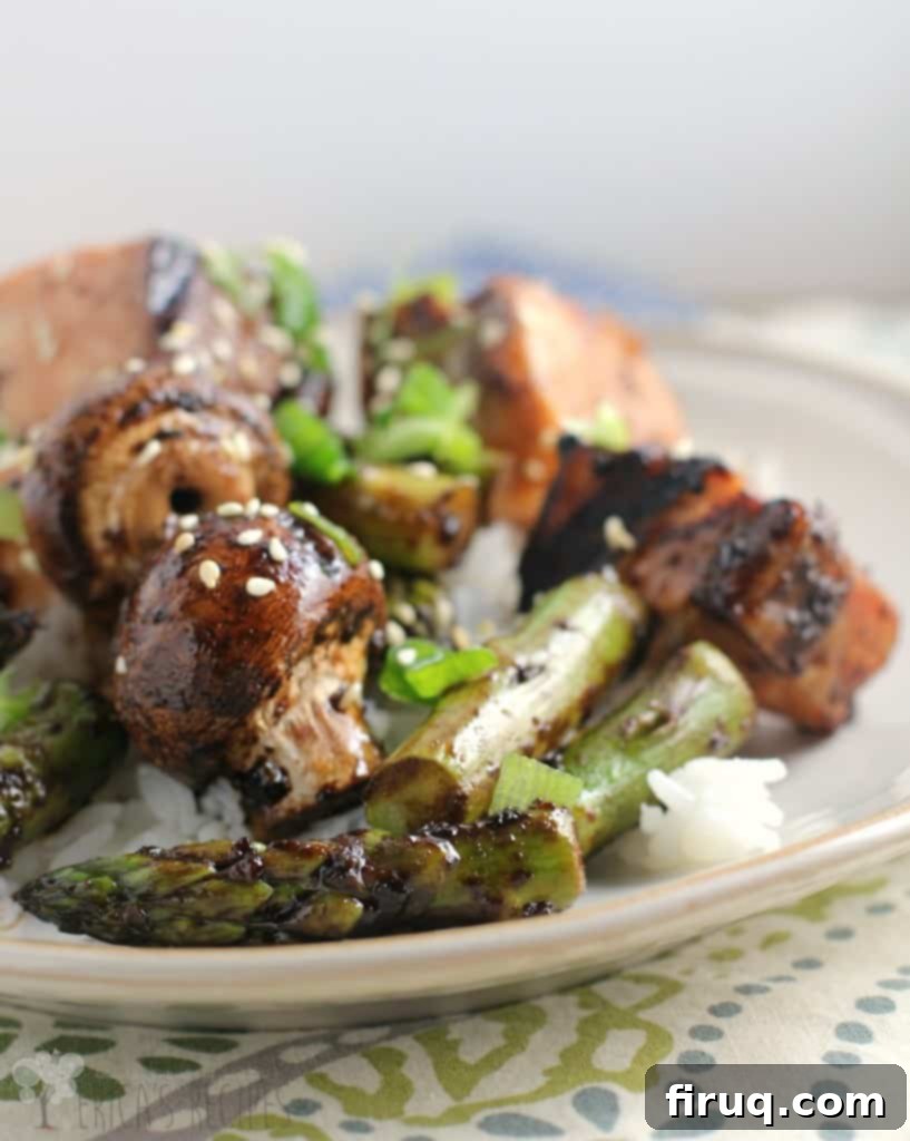 Balsamic Glazed Salmon Skewers 6 Plate of Sweet Balsamic Salmon Kabobs, close-up with fresh garnish
