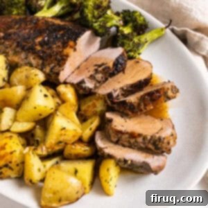 Rustic Italian Cast Iron Pork Tenderloin 11 Sliced Italian Cast Iron Pork Tenderloin served with sides on a plate.
