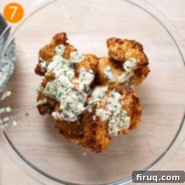 Ultimate Air Fryer Parmesan Chicken 10 Air fried chicken thighs in a bowl with the sauce.