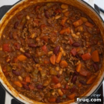 Golden Harvest Chili 11 Chili simmering in the dutch oven, allowing flavors to meld and liquid to reduce.