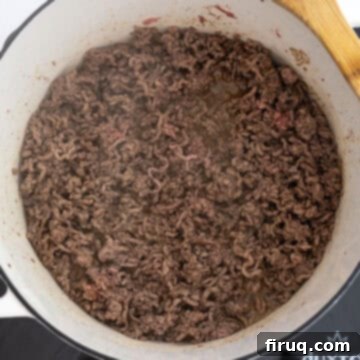 Golden Harvest Chili 4 Browning the ground beef in a Dutch oven with spices.