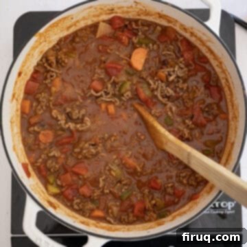 Golden Harvest Chili 9 Diced tomatoes with chilis and browned ground beef added back to the dutch oven.