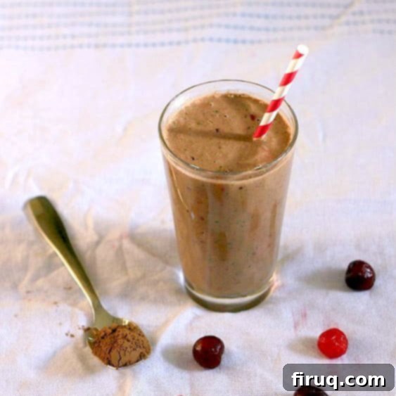 Chocolate Cherry Smoothie Featured Image Close-up of a glass of chocolate cherry smoothie, garnished with a cherry.