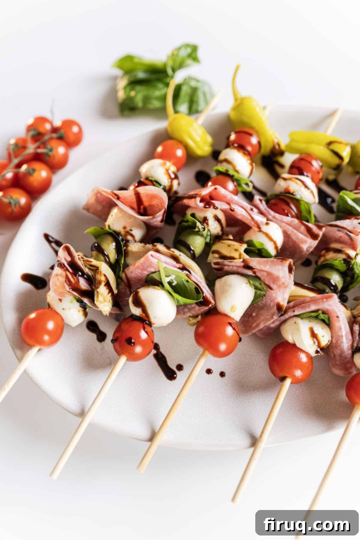 Mini Caprese Bites 2 Caprese skewers on a plate, beautifully arranged and ready to serve.
