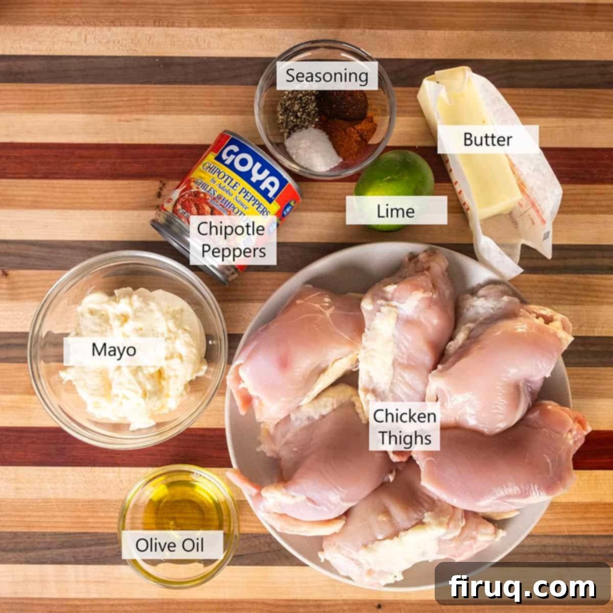 Zesty Bang Bang Chicken Skewers 3 Assortment of fresh ingredients for Bang Bang Chicken Skewers, including chicken thighs, spices, and chipotle mayo components.