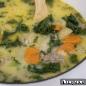 Creamy Tuscan Sausage and Potato Soup 12 A bowl of Zuppa Toscana with carrots, potatoes, and sausage, ready to be served.