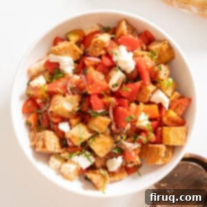 Rustic Tuscan Panzanella 11 A vibrant bowl of Traditional Panzanella Salad with cubed bread, fresh tomatoes, basil, and mozzarella.