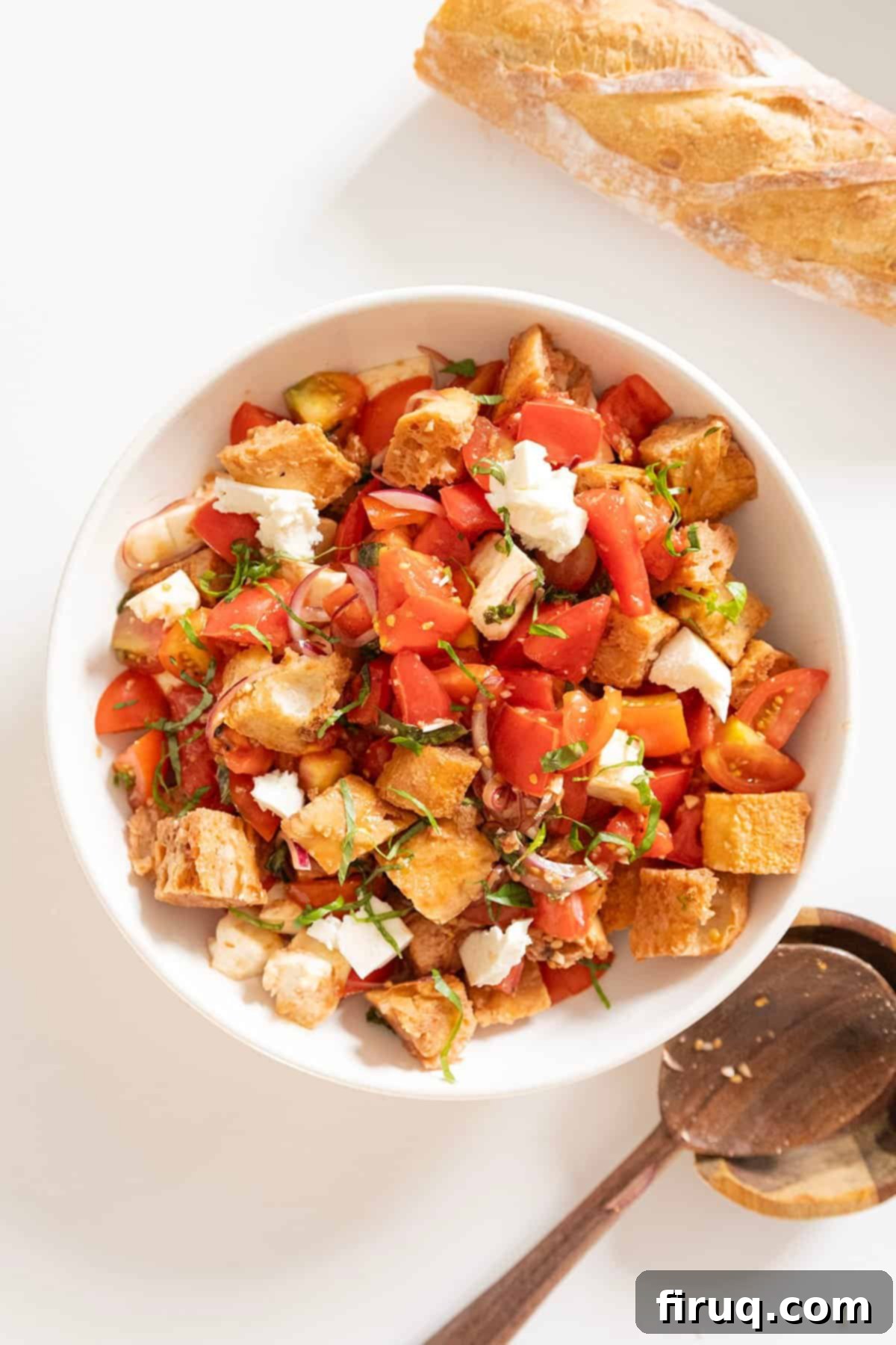 Rustic Tuscan Panzanella 10 A close-up of the finished Panzanella bread salad in a bowl, showcasing the moist, flavorful bread cubes mixed with tomatoes, basil, and mozzarella.