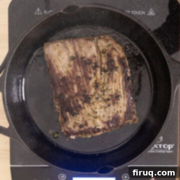 Vibrant Chimichurri Steak Tacos 11 Steak seared on cast iron pan.