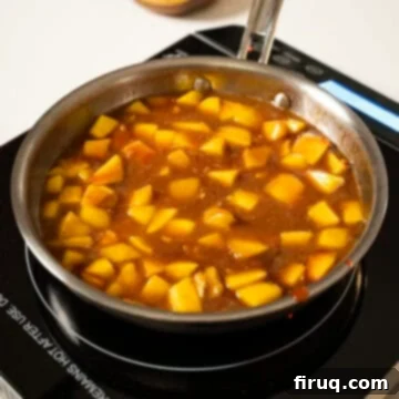 Pork Chops with Bourbon Peach Glaze 6 Peaches simmering in the sauce.