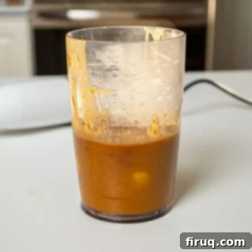 Pork Chops with Bourbon Peach Glaze 7 Bourbon peach sauce blended in a measuring cup.