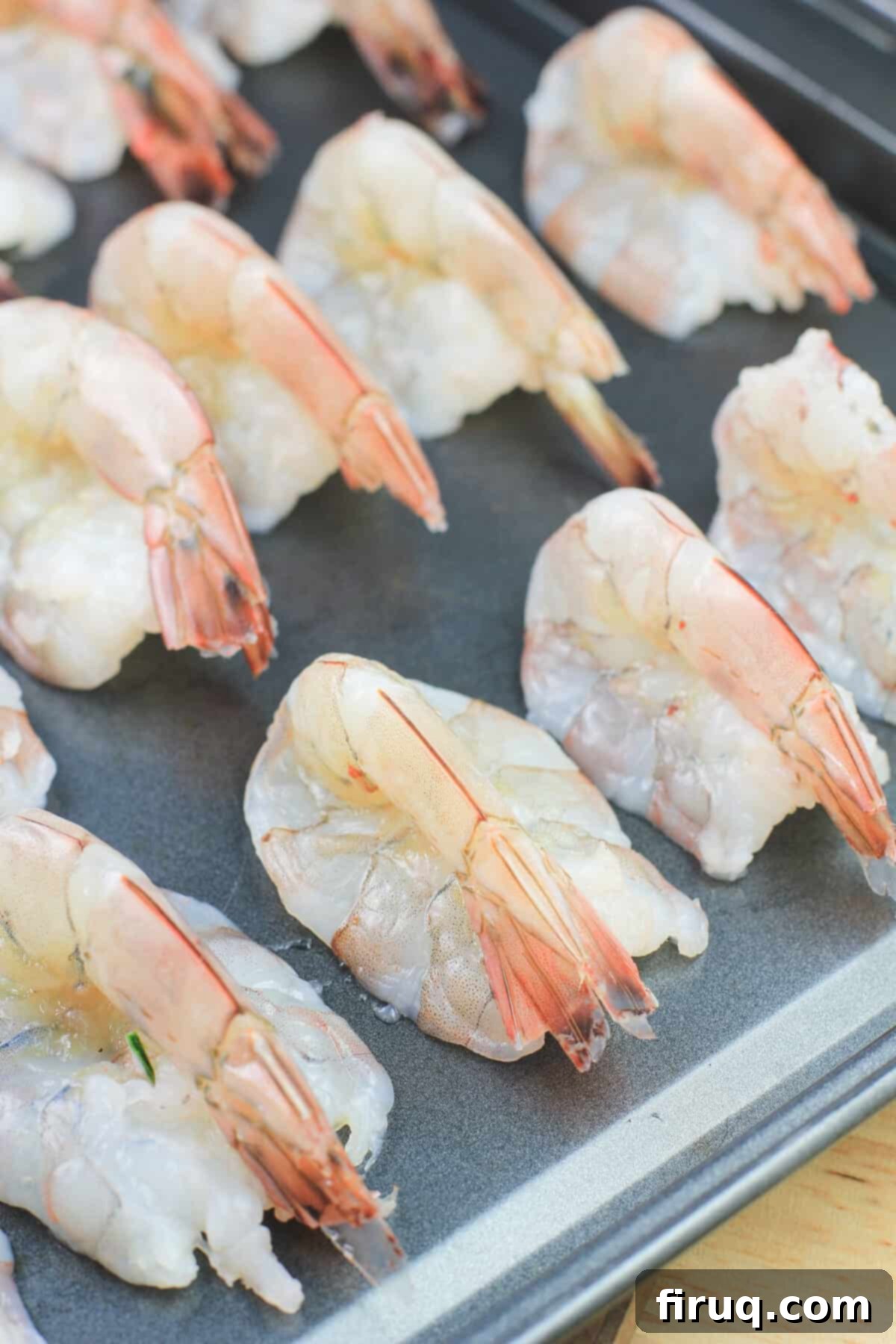Crab Filled Shrimp with Bacon 5 butterflied shrimp on bake sheet, ready for stuffing