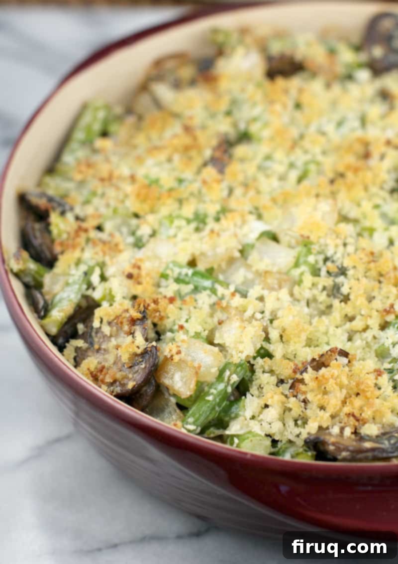 Creamy Asparagus Bake 3 Golden-brown Asparagus Casserole baked in a red baking dish, showing a perfectly crisp topping.