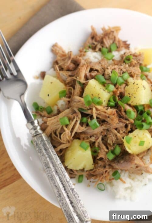 Luau-Ready Pineapple Pulled Pork & Coconut Rice 2 Close-up of Pineapple Pulled Pork, showcasing its tender texture and sweet-savory glaze