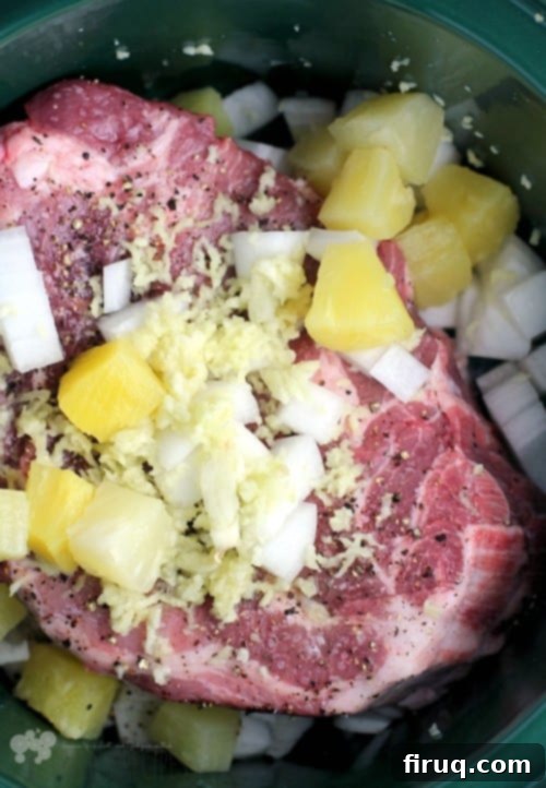 Luau-Ready Pineapple Pulled Pork & Coconut Rice 3 A serving suggestion of Pineapple Pulled Pork and Coconut Rice, garnished with fresh herbs
