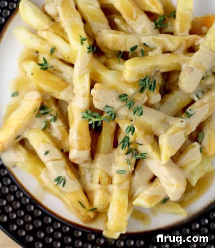 Indulgent Vegan Poutine 4 Vegan Poutine with two delicious sauces