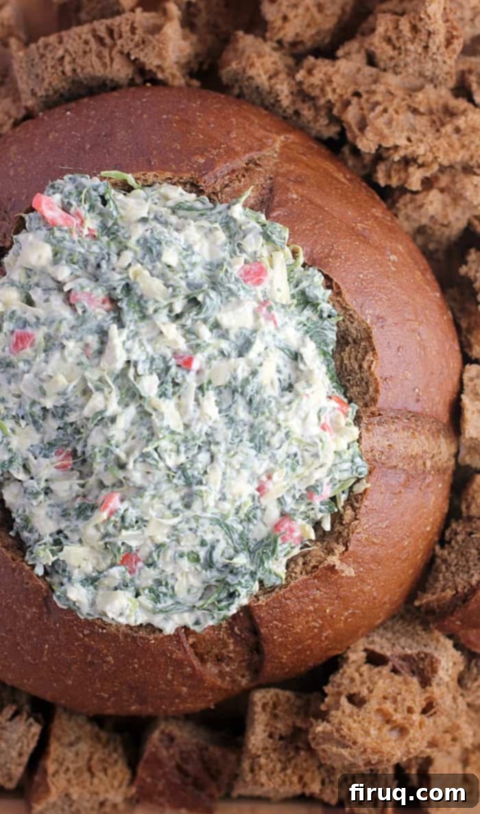 Effortless Vegan Spinach Artichoke Dip 3 No-Bake Vegan Spinach Artichoke Dip in a bread bowl