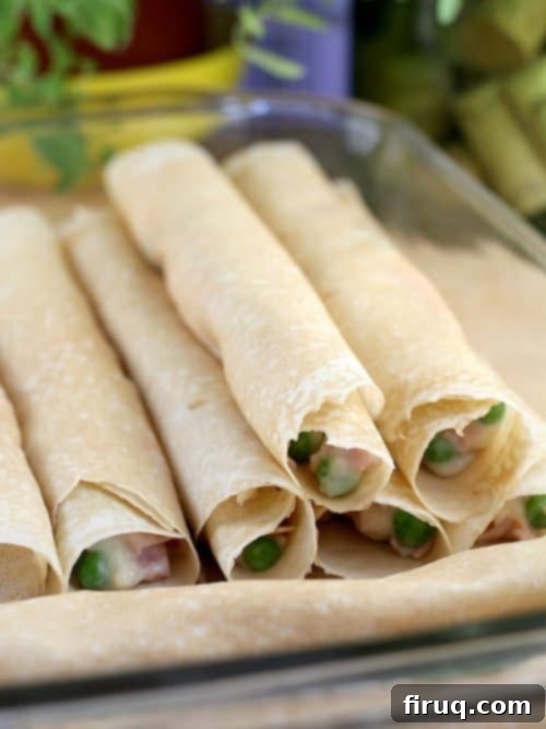 Savory Ham, Pea, and Cheese Crepes 7 Ingredients for Ham, Peas, and Cheese Crepes laid out, including ham, peas, and shredded cheese.