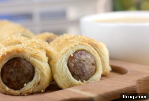 Bira Aromalı Sosis Bohçaları ve Füme Gouda Fondü 7 Sliced Beer Brats in Blankets showing puff pastry and sausage