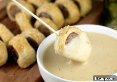 Bira Aromalı Sosis Bohçaları ve Füme Gouda Fondü 9 Beer Brats in Blankets served with Smoked Gouda Fondue in a bowl