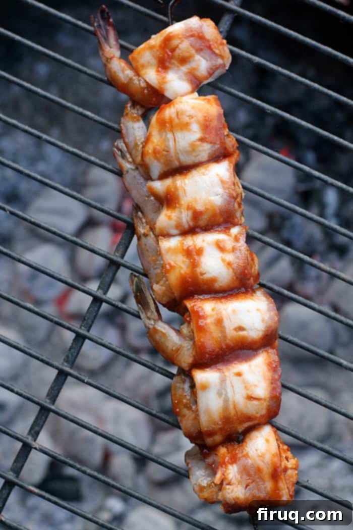 BBQ Bacon Shrimp Bombs 10 Serving platter of Bacon-Wrapped BBQ Stuffed Shrimp at a tailgate party.