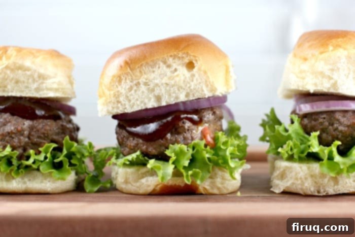 Loaded Port Cheddar BBQ Sliders 7 Broiled Port Wine Cheddar Stuffed BBQ Sliders cooking on a baking sheet, golden brown