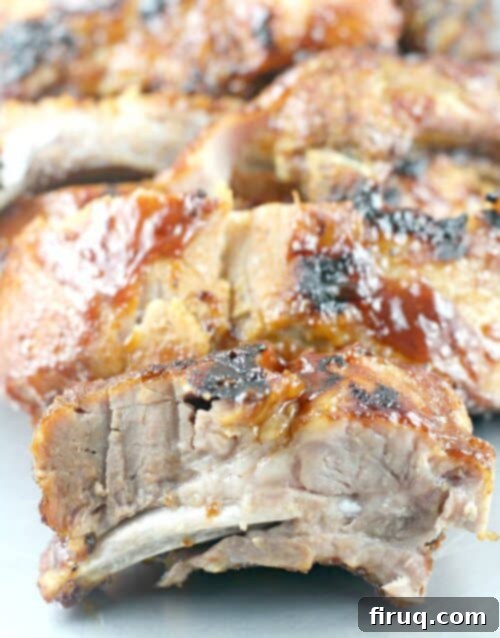 Brewmaster's Baby Back Ribs 2 Perfectly grilled Beer Barbecue Baby Back Ribs on a platter, ready to serve
