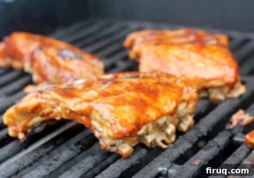 Brewmaster's Baby Back Ribs 8 A family enjoying grilled Beer Barbecue Baby Back Ribs outdoors
